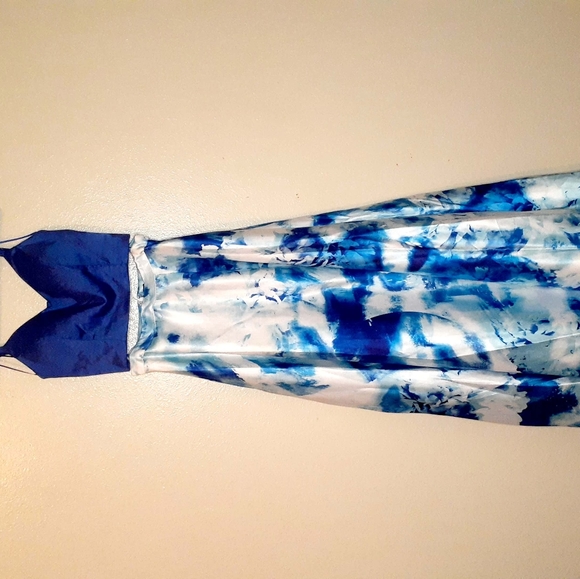 An all blue top and a white and blue floral tie-die mixed two piece dress. - Picture 1 of 7